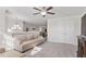 Spacious bonus room with neutral carpet, modern chandelier and light, and a comfortable sofa at 330 Macallan Dr, Burlington, NC 27215