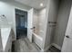 The bathroom features a shower/tub combo and wood look floors at 333 S Main St, Four Oaks, NC 27524