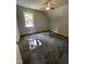 This cozy bedroom includes neutral colored walls, carpet and a ceiling fan at 333 S Main St, Four Oaks, NC 27524
