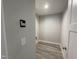 The laundry room features gray walls, gray floors, and includes modern smart home features at 333 S Main St, Four Oaks, NC 27524