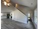 An open-concept living area showcases wood floors and seamless transition to the kitchen at 333 S Main St, Four Oaks, NC 27524
