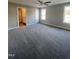 Spacious main bedroom featuring plush carpeting, neutral wall paint, and abundant natural light from windows at 333 S Main St, Four Oaks, NC 27524