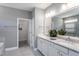 Modern bathroom with double vanity, white cabinets, quartz countertops, and stylish plant accents at 344 Arcadius Dr, Clayton, NC 27520