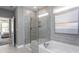 Contemporary bathroom featuring a glass enclosed shower, soaking tub, and stylish tile work at 344 Arcadius Dr, Clayton, NC 27520