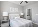 This modern bedroom features neutral decor, ceiling fan, and ensuite bathroom at 344 Arcadius Dr, Clayton, NC 27520
