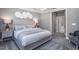 Calming main bedroom with a tray ceiling, two side tables and a decorative art piece on the wall at 344 Arcadius Dr, Clayton, NC 27520