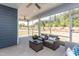 This screened porch features a ceiling fan and comfortable wicker furniture at 344 Arcadius Dr, Clayton, NC 27520