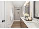 Bathroom with double vanity, large mirror, and walk-in shower at 344 Church St, Morrisville, NC 27560