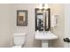 Small bathroom featuring a sink, toilet, and neutral decor at 344 Church St, Morrisville, NC 27560