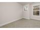 An empty, freshly-painted and carpeted bedroom with neutral colors at 344 Church St, Morrisville, NC 27560