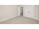 An empty bedroom with carpet floors and white trim at 344 Church St, Morrisville, NC 27560