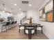 Inviting dining area features a dark wood table and chairs, modern lighting, and stylish decor at 344 Church St, Morrisville, NC 27560