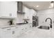 Modern kitchen featuring granite countertops, stainless steel appliances, and subway tile backsplash at 344 Church St, Morrisville, NC 27560