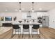 Stunning kitchen with granite island, stainless appliances, and modern lighting fixtures at 344 Church St, Morrisville, NC 27560