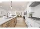 Bright, open kitchen featuring stainless appliances and a large island with seating at 344 Church St, Morrisville, NC 27560