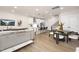 Spacious open-plan living room and kitchen with modern decor, stainless steel appliances, and wood floors at 344 Church St, Morrisville, NC 27560