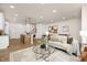 Open floorplan with kitchen island and living room featuring modern decor and furnishings at 344 Church St, Morrisville, NC 27560