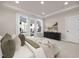 Bright main bedroom boasts a large bed, soft carpet, balcony access, and stylish decor at 344 Church St, Morrisville, NC 27560