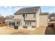 A well-maintained backyard with a screened-in porch and patio area, perfect for outdoor dining and relaxation at 372 Lynshire Ave, Clayton, NC 27527