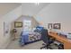 Attic bedroom with a comfortable bed, study desk, and charming decor at 372 Lynshire Ave, Clayton, NC 27527
