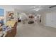 Spacious bonus room features plush carpeting, access to bedrooms, and a cozy seating area with an accent wall at 372 Lynshire Ave, Clayton, NC 27527