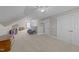Light-filled bonus room with comfortable seating, a ceiling fan, and versatile floor space at 372 Lynshire Ave, Clayton, NC 27527