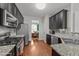 Modern kitchen features stainless steel appliances and granite countertops at 372 Lynshire Ave, Clayton, NC 27527
