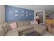 Comfortable living room with a large sectional sofa, colorful decorations, and a cozy atmosphere at 372 Lynshire Ave, Clayton, NC 27527