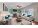 Cozy living room with a fireplace and bright light from the large window at 372 Lynshire Ave, Clayton, NC 27527