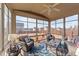 Inviting sunroom with comfortable seating, creating a cozy space for relaxation and enjoyment at 372 Lynshire Ave, Clayton, NC 27527