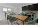 Stylish dining area with modern black cabinetry, marble backsplash, and seating for four at 509 Sherron Rd # 22, Durham, NC 27703