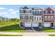 Eye-catching townhomes with varied exteriors, well-kept lawns, and convenient driveway access at 509 Sherron Rd # 22, Durham, NC 27703