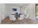 Office space with sleek desk, modern chairs, and natural light from large windows at 509 Sherron Rd # 22, Durham, NC 27703