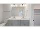 Bright bathroom features double sinks with gray cabinetry and brushed nickel hardware at 509 Sherron Rd # 25, Durham, NC 27703