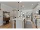 Bright kitchen with large island, pendant lighting, and a seamless flow to the dining area at 509 Sherron Rd # 25, Durham, NC 27703