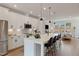 Open-concept kitchen features white cabinetry, stainless steel appliances, and a large island at 509 Sherron Rd # 25, Durham, NC 27703
