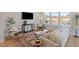 Inviting living room with comfortable seating, stylish rug, and large windows for natural light at 509 Sherron Rd # 25, Durham, NC 27703