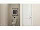 Compact powder room with a standard toilet and a modern art piece above at 536 Morning Light Dr, Angier, NC 27501