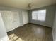 This bedroom has tile floors, a ceiling fan and natural light from the window at 602 S Massey St, Selma, NC 27576