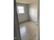 A bright bedroom with a window and hard surface floors at 602 S Massey St, Selma, NC 27576