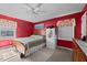 Bedroom showcasing carpet, a wooden bed frame, and a safe at 6480 Union Ridge Rd, Burlington, NC 27217