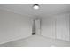 Bedroom features soft carpet, neutral paint, ceiling fan, and closet space at 900 Ricon Pl, Durham, NC 27703