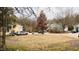 Exterior street view showcases the front yard, neighborhood homes, and a parked vehicle at 1106 Proctor St, Durham, NC 27707