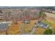 Aerial view of a house with a red door, surrounded by bare trees and other homes at 113 Belgium Pl, Zebulon, NC 27597