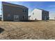 Large backyard of a two-story home with a sliding glass door and newly installed sod at 1137 Centerview Dr, Nashville, NC 27856