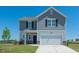 Inviting two-story home with a two-car garage, manicured lawn, and charming curb appeal at 1137 Centerview Dr, Nashville, NC 27856