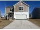 Beautiful new construction home featuring a large garage and neutral siding, ready for personalization at 1137 Centerview Dr, Nashville, NC 27856