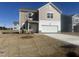 New two-story home with attached garage, fresh lawn and neutral-toned siding, set in a modern neighborhood at 1137 Centerview Dr, Nashville, NC 27856