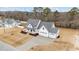 Expansive aerial view of a two-story home with three car garage on a spacious lot at 120 Lane Farms Way Way, Holly Springs, NC 27540