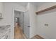 Hallway leads to laundry room featuring modern appliances and custom cabinetry at 120 Lane Farms Way Way, Holly Springs, NC 27540